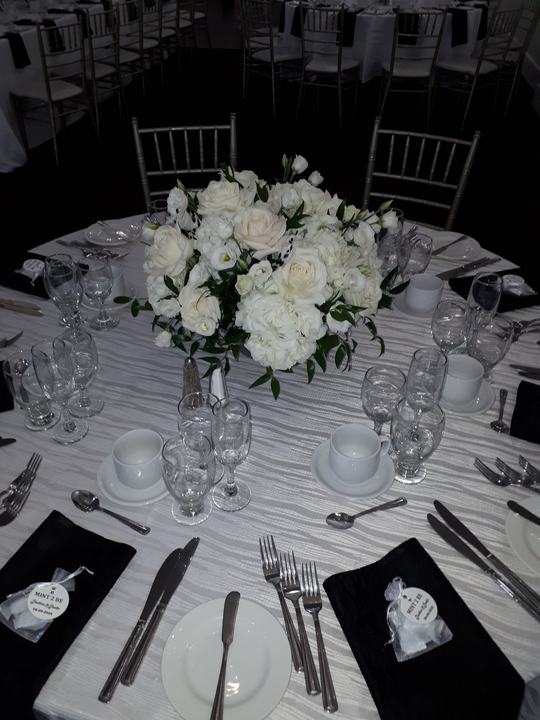 White floral centerpiece round table