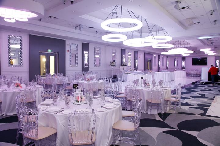 Ballroom purple uplight ghost chairs