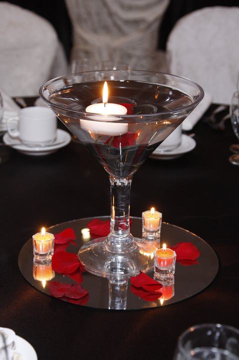 Martini-glass floating candle centerpiece rose petals