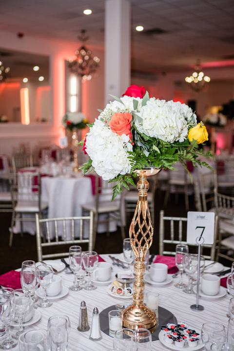 Tall gold centerpiece coral and white