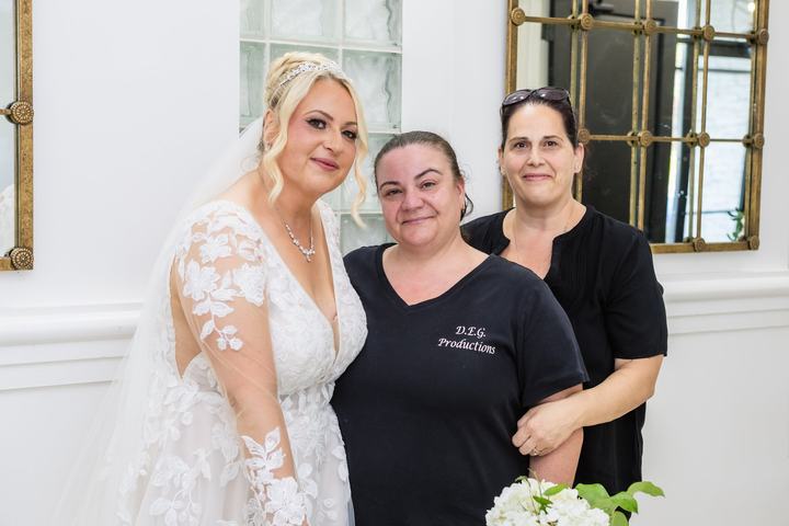 A bride with two of the D.E.G. Productions team
