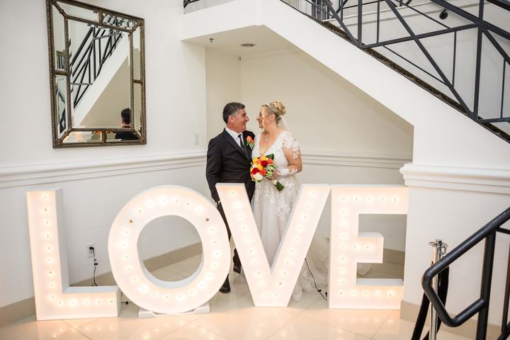 The couple with marquee LOVE letters