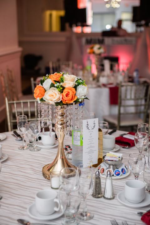 Orange and white rose centerpiece gold crystal stand