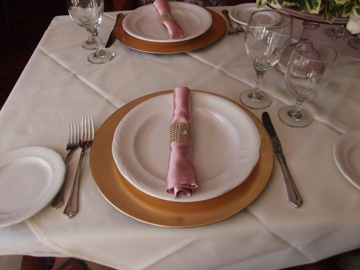 Gold charger pink napkin gold ring place setting