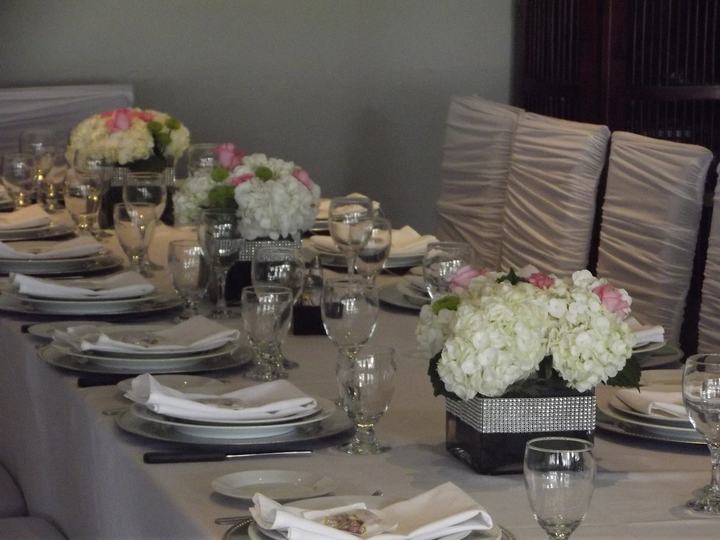 Long table hydrangea in rhinestone boxes, ruched chair covers