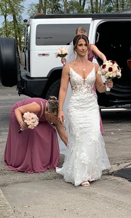 Bride stepping out of white Hummer limo