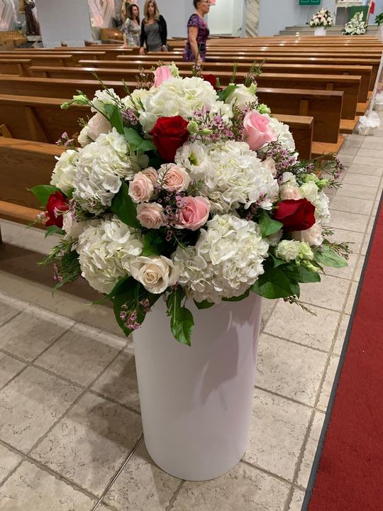 Church aisle pedestal arrangement roses and hydrangea
