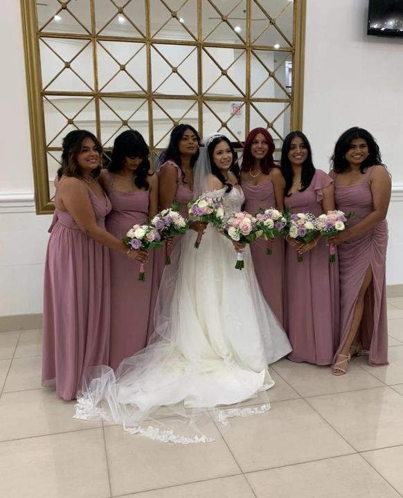 Bride with bridesmaids holding bouquets