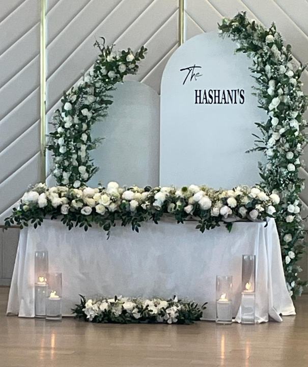 'The Hashani's' arch panels, white and green florals head table