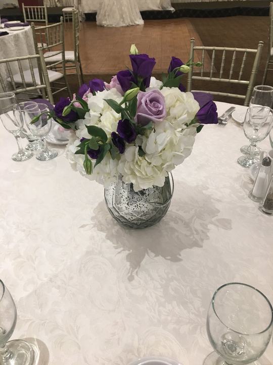 Purple and white rose centerpiece mercury vase