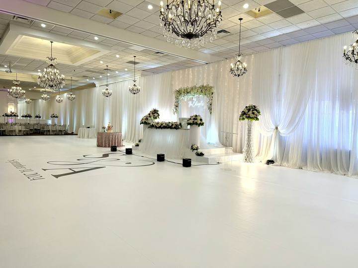 Room with a monogrammed white floor wrap