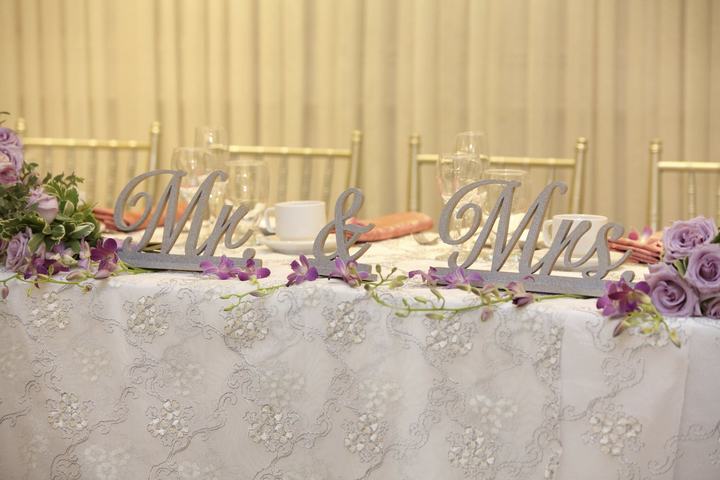 'Mr & Mrs' letters on head table purple florals