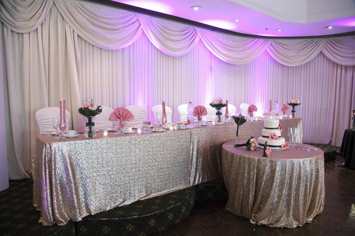 Swag drapery head table sequin, cake table pink uplighting