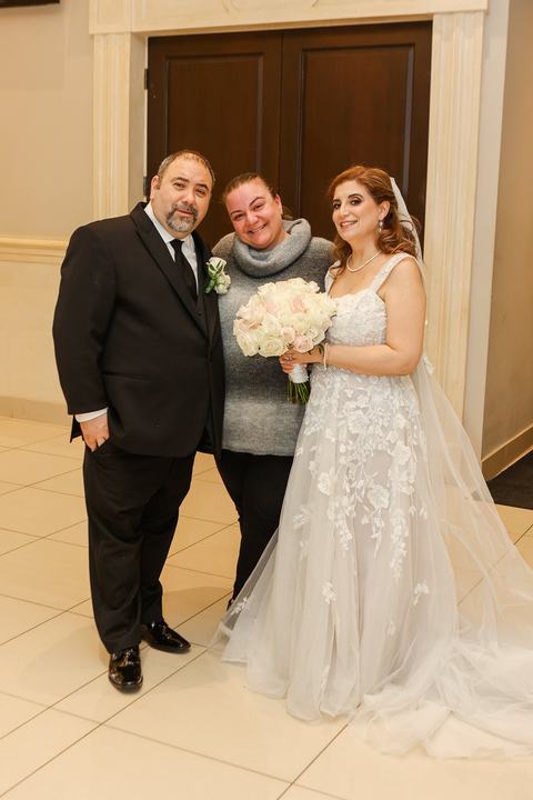 Newlyweds with a member of the D.E.G. team