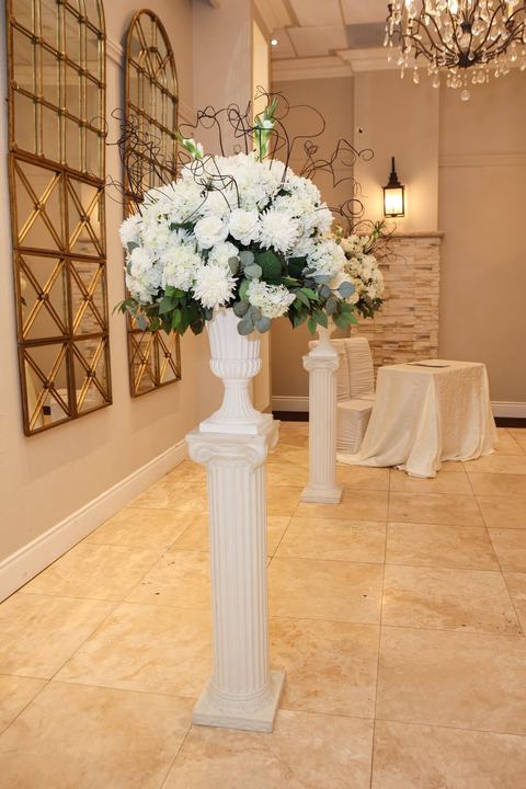 Ceremony pedestal white florals, arched mirrors