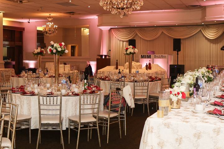 Ballroom with the Music In Motion DJ booth at the back