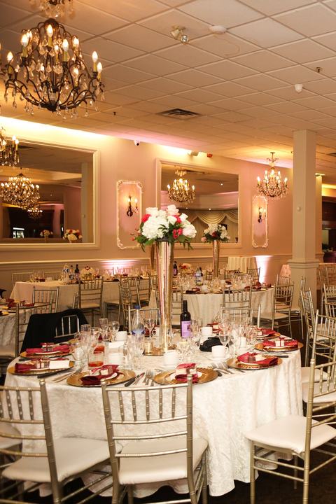 Ballroom with chandeliers and tall centerpieces